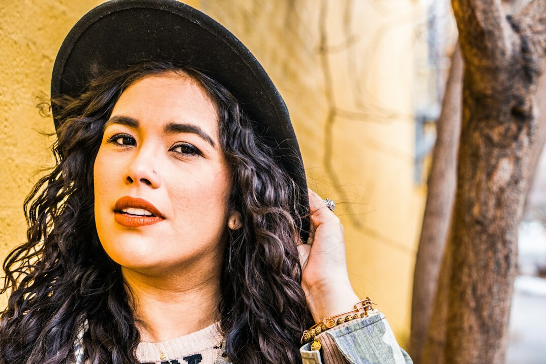Portrait of a Latina woman with curly hair