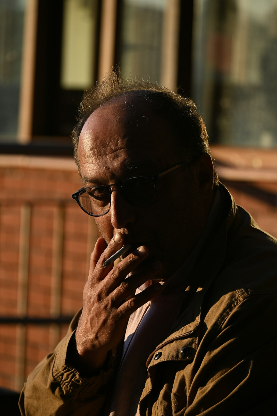 Portrait of an older Latino man with glasses