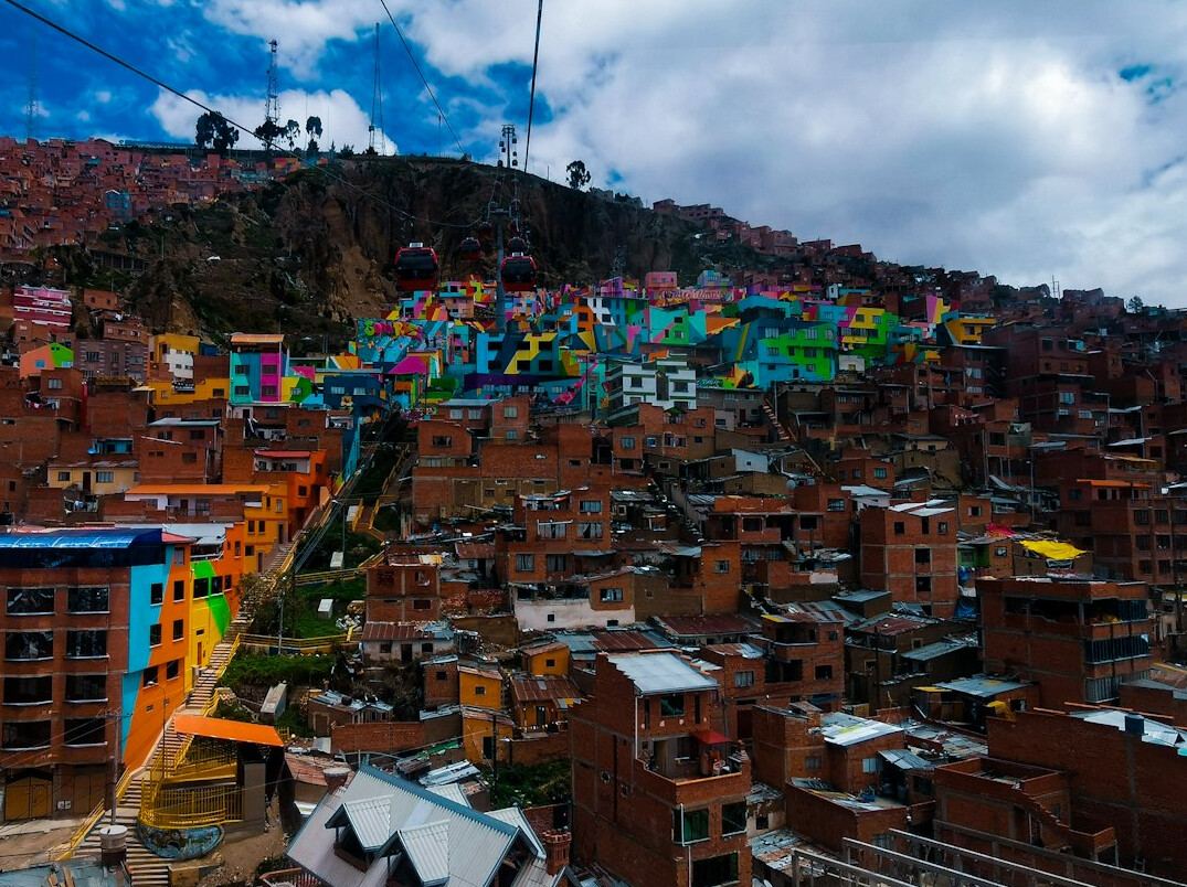 Colorful houses on a steep hillside street in a South American city